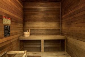 a wooden sauna with a wooden bench in it at Shilo Inn Suites Ocean Shores in Ocean Shores