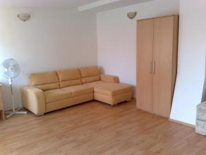 a living room with a couch and a closet at Ubytovani U Kulky in Kyjov