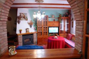 Televízia a/alebo spoločenská miestnosť v ubytovaní La Buhardilla