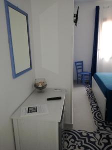 Llit o llits en una habitació de Benvenuti al Sud B&B