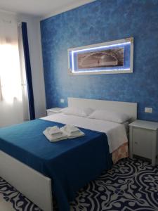 Llit o llits en una habitació de Benvenuti al Sud B&B