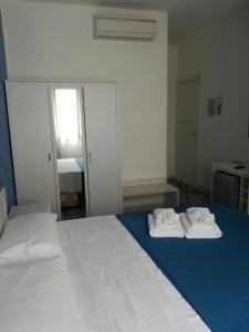 Llit o llits en una habitació de Benvenuti al Sud B&B