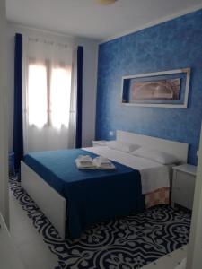 Llit o llits en una habitació de Benvenuti al Sud B&B