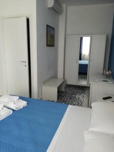 Llit o llits en una habitació de Benvenuti al Sud B&B