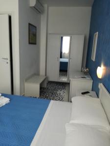Llit o llits en una habitació de Benvenuti al Sud B&B