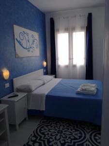 Llit o llits en una habitació de Benvenuti al Sud B&B