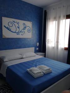 Llit o llits en una habitació de Benvenuti al Sud B&B