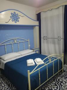Llit o llits en una habitació de Benvenuti al Sud B&B
