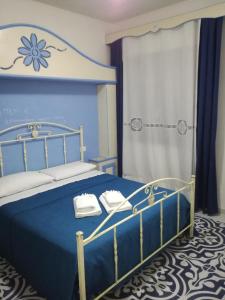 Llit o llits en una habitació de Benvenuti al Sud B&B