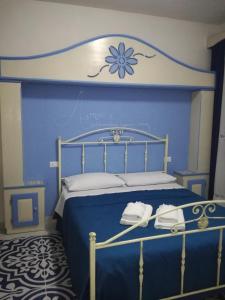 Llit o llits en una habitació de Benvenuti al Sud B&B