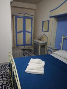 Llit o llits en una habitació de Benvenuti al Sud B&B