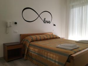 Postel nebo postele na pokoji v ubytování Infinity