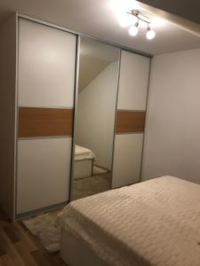 Postel nebo postele na pokoji v ubytování Apartman MIG