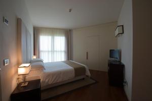 Posteľ alebo postele v izbe v ubytovaní Eden Rock Resort