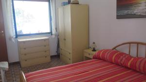 Postel nebo postele na pokoji v ubytování Casa con giardino sulla spiaggia