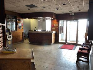 a large room with a counter in a restaurant at Agassiz Park Lodge in McCreary