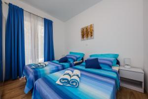 Posteľ alebo postele v izbe v ubytovaní Villa Nora