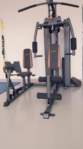 a gym with two exercise bikes on a treadmill at Vivendas Hotel in Erechim