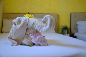 Postel nebo postele na pokoji v ubytování Hotel Melina
