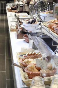 a buffet line with many different types of pastries at Kisarazu Washington Hotel in Kisarazu