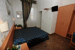 Posteľ alebo postele v izbe v ubytovaní Hotel Miramare