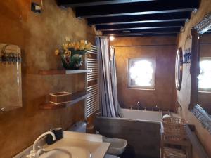 a bathroom with a sink and a tub and a toilet at La Casa Sopra Le Nuvole in Medesano +44 photos