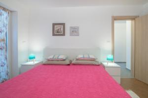 Postel nebo postele na pokoji v ubytování Villa Alice App2