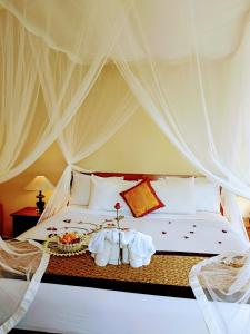 Posteľ alebo postele v izbe v ubytovaní Inang Villa