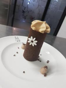 a chocolate ice cream cone with a flower on it at Best Western Plus Hotel des Francs in Soissons