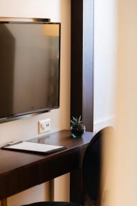 TV a/nebo společenská místnost v ubytování Hotel Taverna