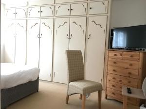 เตียงในห้องที่ Wynchlands 4 Bedroom House in St Albans City