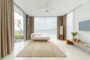 Voodi või voodid majutusasutuse Svarga Resort Lombok toas