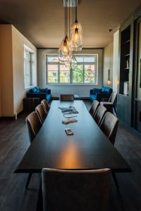 a large dining room with a large table and chairs at Hotel Taverna in Tafers