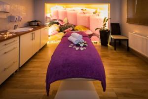 Postel nebo postele na pokoji v ubytování Król Plaza Spa & Wellness