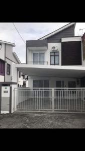 a white fence in front of a house at Decozy Homestay (14pax++) in Ipoh