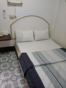 Postelja oz. postelje v sobi nastanitve Yongxing Inn