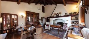 a living room with a table and a dining room at Villa Irene in Magione