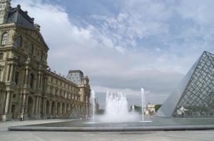 a fountain in front of a building with a clock tower at ibis Styles Paris Boulogne Marcel Sembat in Boulogne-Billancourt