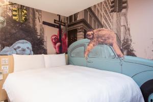 Katil atau katil-katil dalam bilik di Morwing Hotel - Culture Vogue