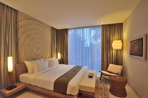 Voodi või voodid majutusasutuse Svarga Resort Lombok toas