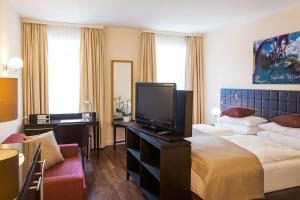 Posteľ alebo postele v izbe v ubytovaní Hotel Sandwirth