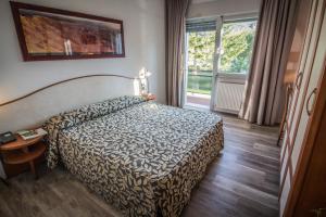 A bed or beds in a room at Garnì Bellavista