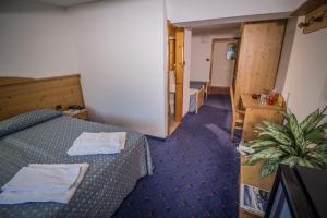 A bed or beds in a room at Garnì Bellavista
