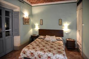 Łóżko lub łóżka w pokoju w obiekcie Villa Il Palazzo