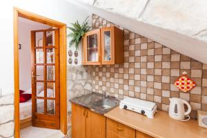 a kitchen with a sink and a counter top at Guest House Mara in Vela Luka +73 photos