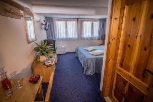 A bed or beds in a room at Garnì Bellavista