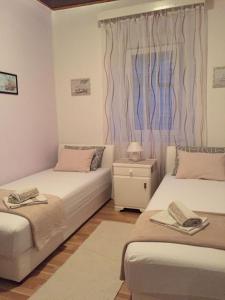 Postel nebo postele na pokoji v ubytování Apartmani Vela Luka