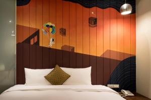 Rúm í herbergi á Merryday Hotel Banqiao