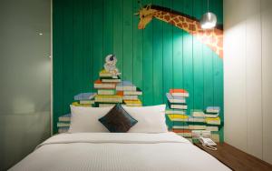 Rúm í herbergi á Merryday Hotel Banqiao