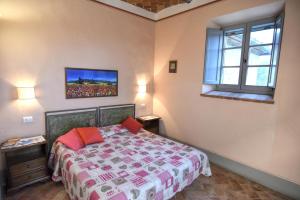 Łóżko lub łóżka w pokoju w obiekcie Villa Il Palazzo